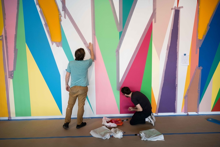 Conor Fields and Alan Prazniak applying paint during installation of "Surrounding."