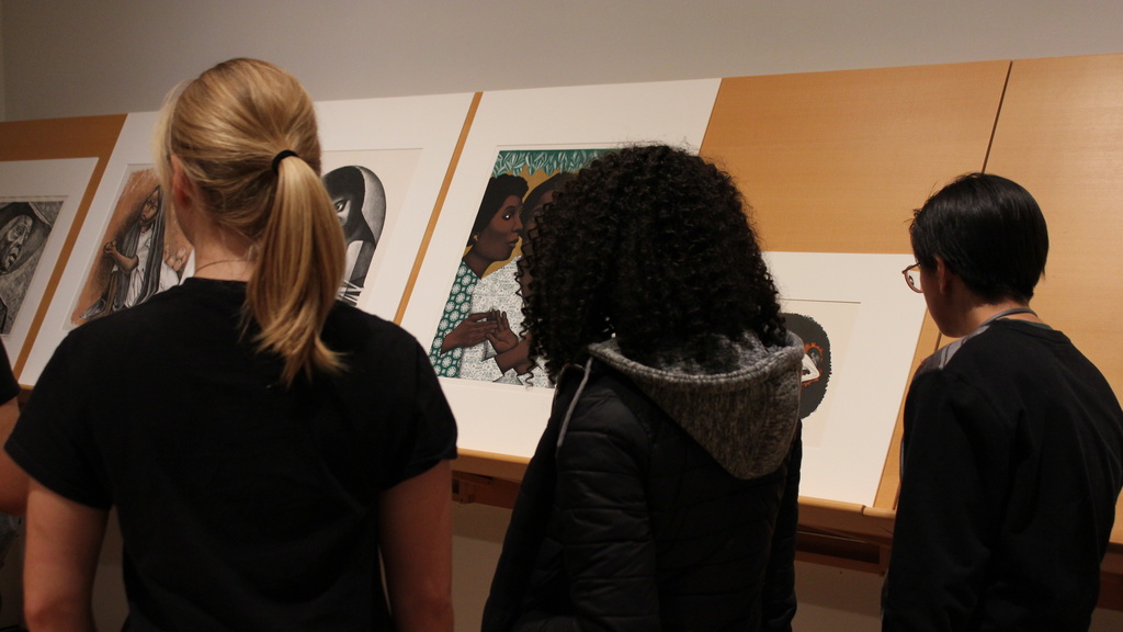 college students viewing artwork