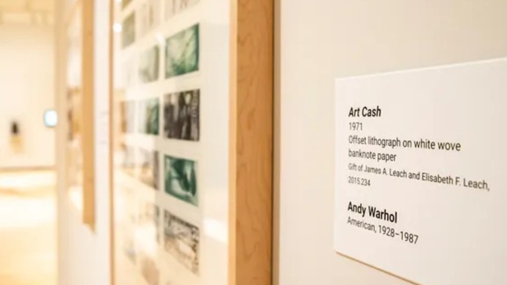 An information placard for Art Cash by Andy Warhol is seen at the Stanley Museum of Art, Thursday, Jan. 26, 2023, on the University of Iowa campus in Iowa City, Iowa.