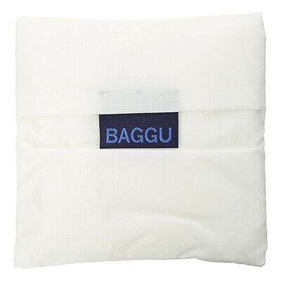 A photo of a white reusable nylon bag, folded into its square pouch.