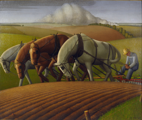 Four horses pull a plow on which a farmer wearing overalls and a brimmed hat leans backwards, holding reigns.