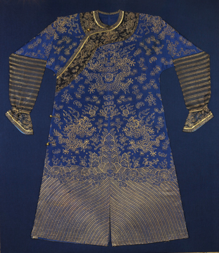 Silk robe in deep blue with metallic gold embroidery. It has bunched black sleeves with gold detailing. Eight gold metallic dragons fly across the blue fabric panel between swirling cloud, bat, and peony motifs, also in gold embroidery.