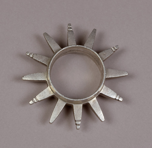 Round metal bracelet encircled with spikes resembling abstract animal horns.