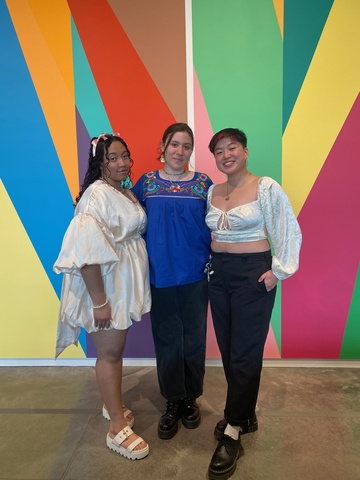 A photo of attendees at the Stanley Campus Council April 13 event, posing together: from left, Lily, Erin, and Samm.