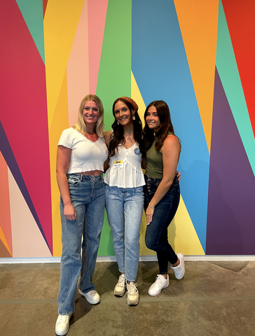 Featured artist Aubrie poses with two of her friends at the event.