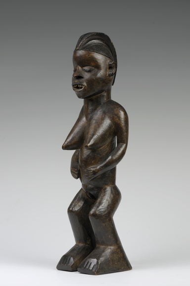 A wooden female figure