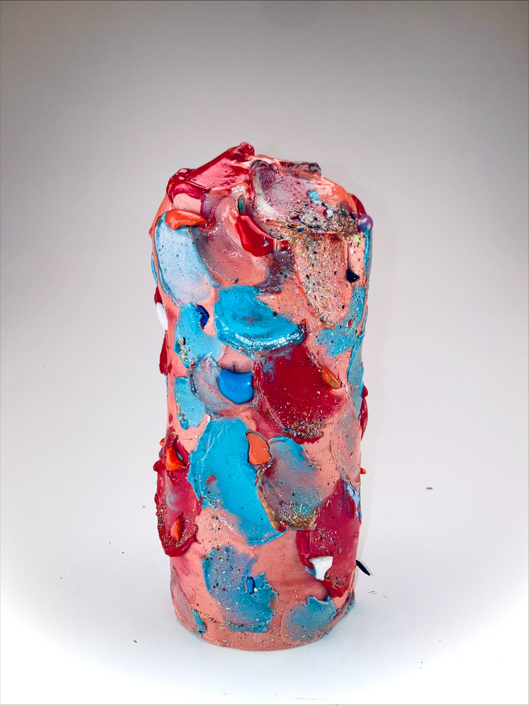 Alyson's work: a blue, pink, and red ceramic vessel.