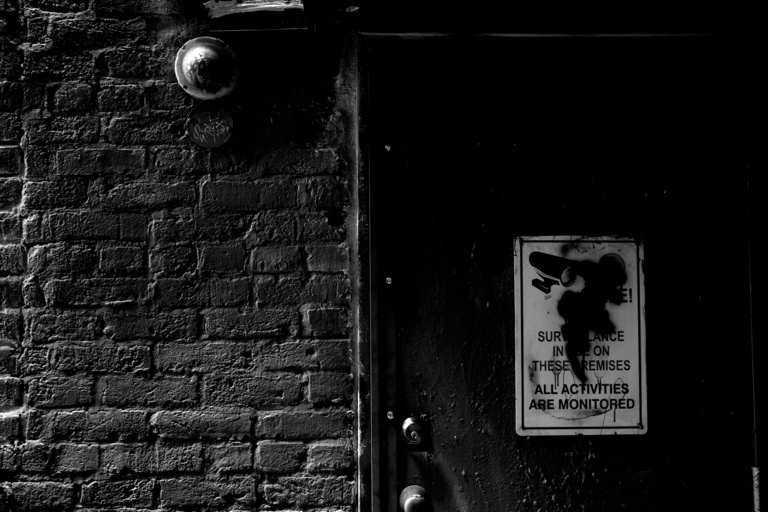Graham's art: a black and white photo of a sign on a brick wall.