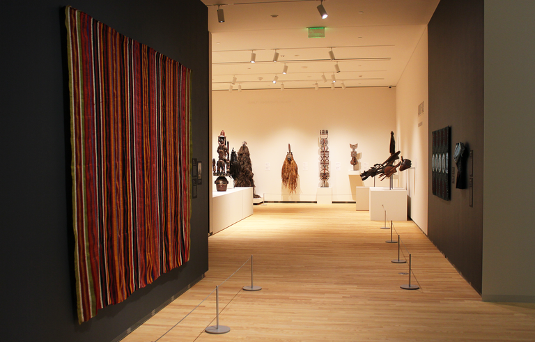 An installation shot looking through "Centering on Cloth" into "About Face."
