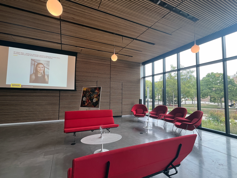 A photo showing the setup of the HBD, SMA event. This view looks north into the Stanley's lobby, showing the placement of the couches and the womb chairs, creating spaces for people to sit and chat.