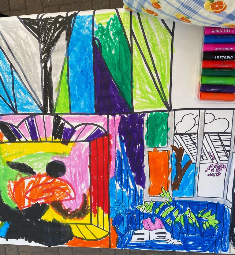 A photo of the coloring pages Bella Epstein made for her summer internship - black and white line drawings, inspired by works of art in the Stanley's collection, colored in by children and families as part of outreach events. 