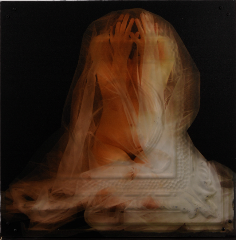 A nude female figure draped with translucent tulle, kneeling down with her hands over head. There is abstract imagery of a cermaic tile overlayed on the image.