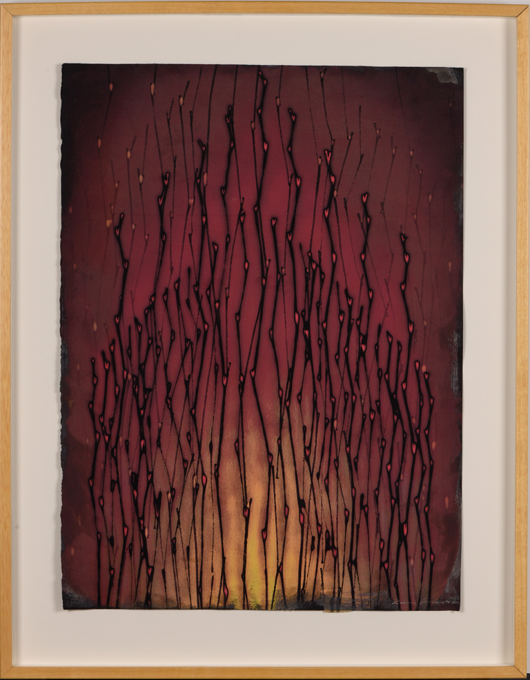 Black branch-like streaks against a gradient of deep reds and amber, taking the shape of an open flame 