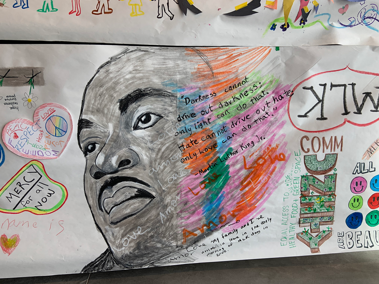 A close up photo of some of the MLK mural drawings. 