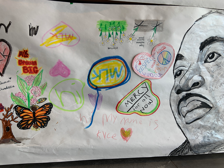 A close up photo of some of the MLK mural drawings. 