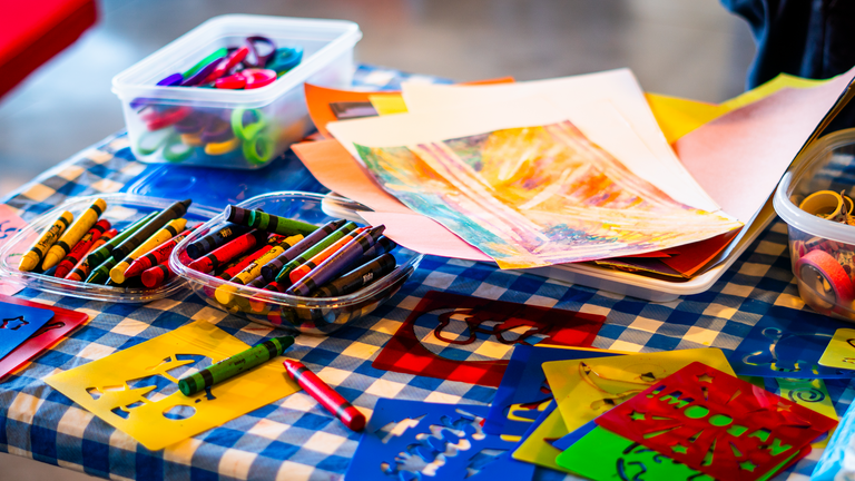 A photo of art supplies used on the murals--stencils, markers, crayons, and more.