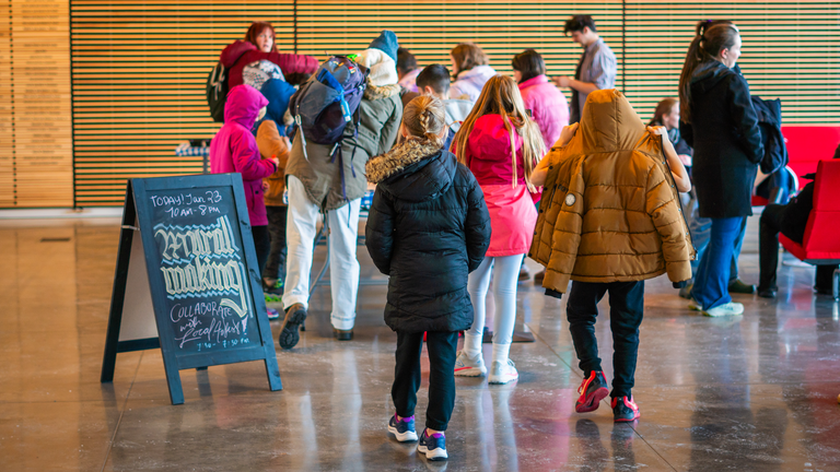 Participants of all ages enter the museum and head towards the mural making station.