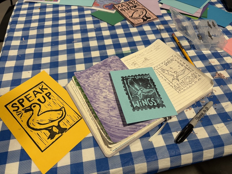 A photo of two prints made by student attendees.