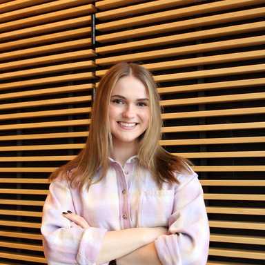 A smiling woman with blonde hair. 