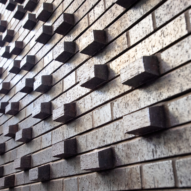 Grey brick laid in a Flemish bond pattern