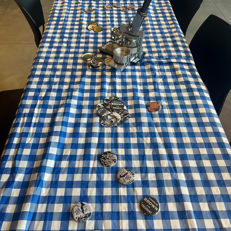 A photo of one of the button making tables at the Art of Voting event