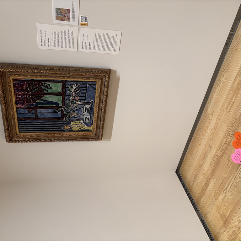 A photo of the galleries showcasing hearts on the floor in front of the Matisse painting.