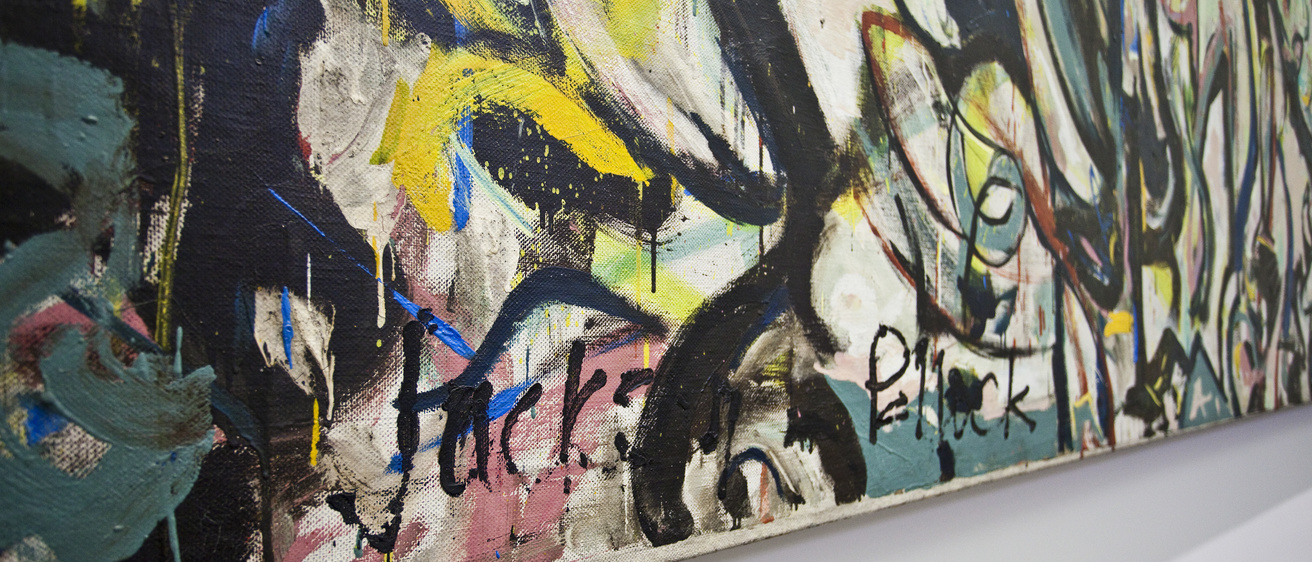 Angled view of Jackson Pollock's "Mural," with artist signature visible