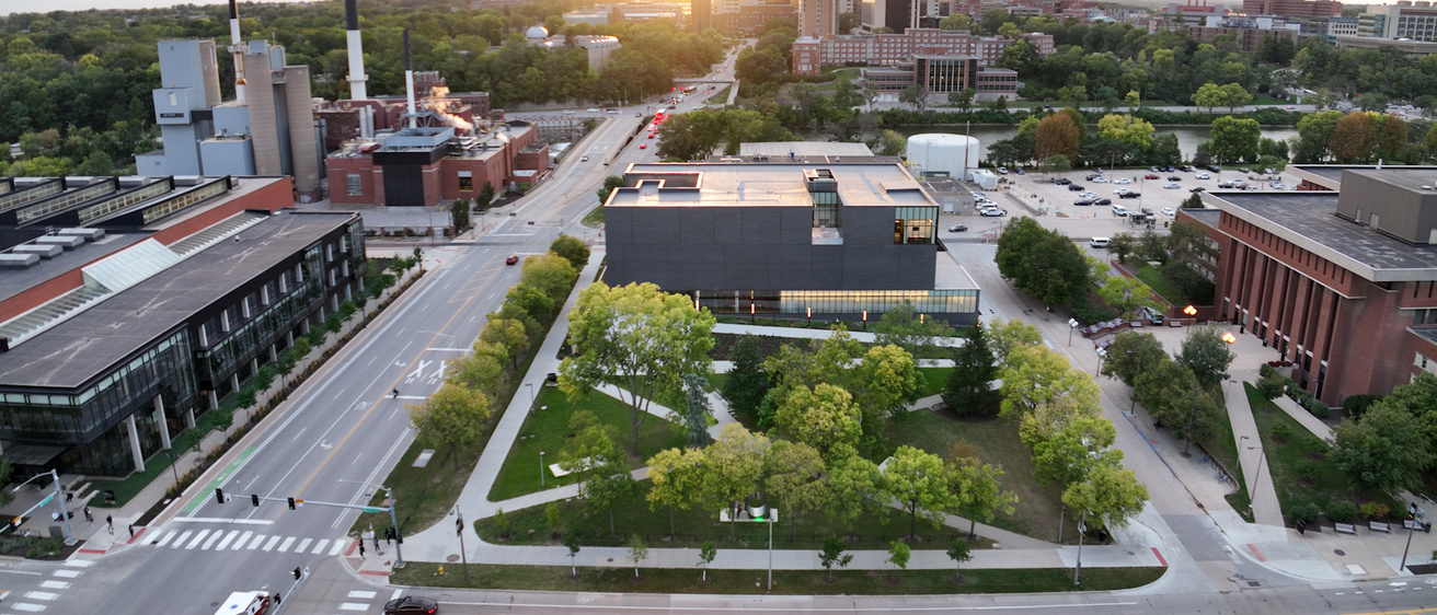 Aerial view of museum with campus recreation center on left and Main Library on right