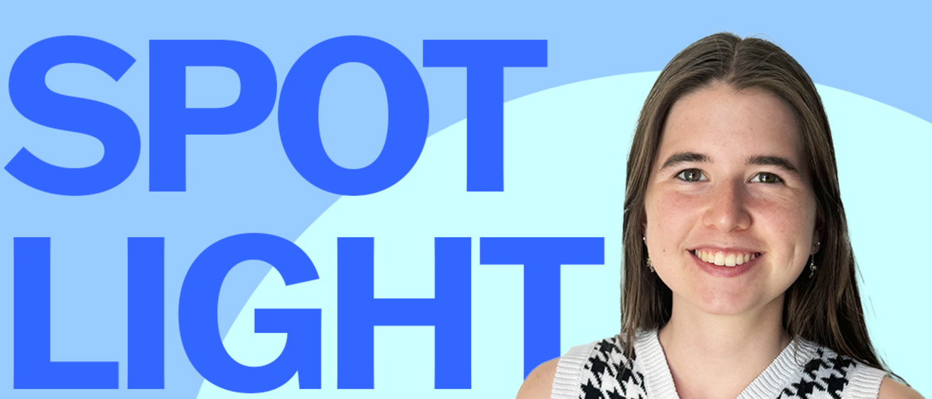 A graphic with the words "Student Spotlight" in shades of blue surrounding a photo of Annelies, smiling in a sweater vest.