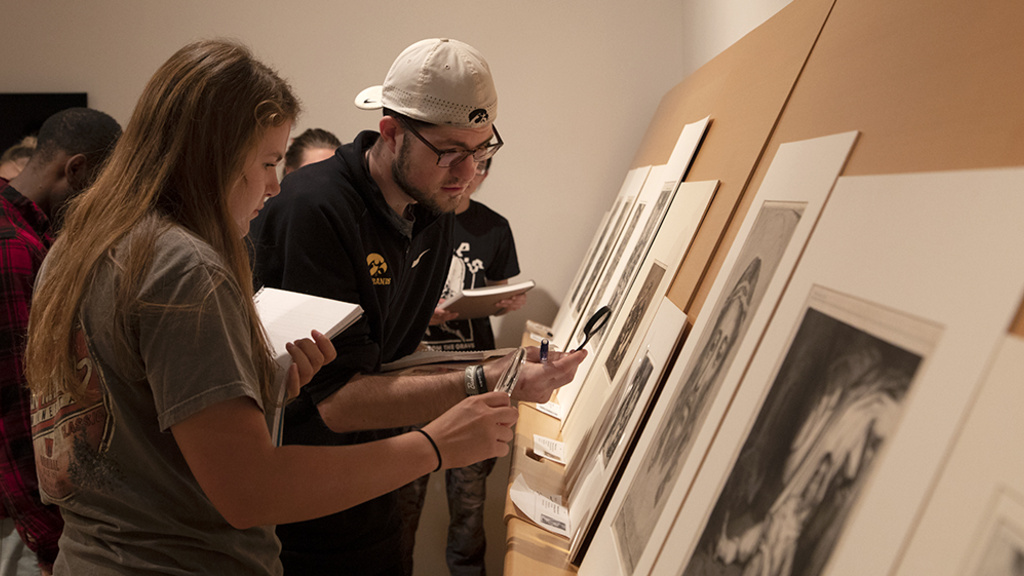 People looking at artwork