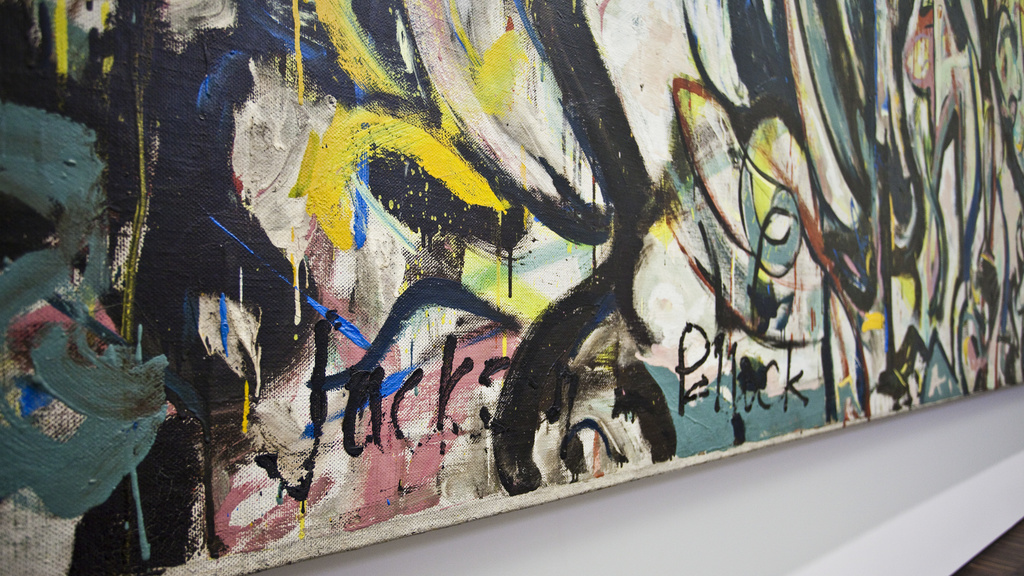 Angled view of Jackson Pollock's "Mural," with artist signature visible