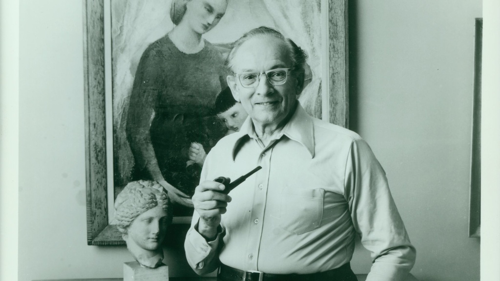 Man with white shirt, holding a pipe, standing in front of painting
