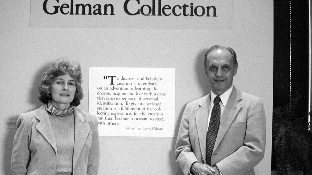 man and woman standing in a museum gallery, the walls have the words "Gelman Collection" 