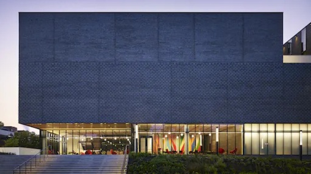 A photo at night of the outside of the Stanley Museum of art by Nick Merrick