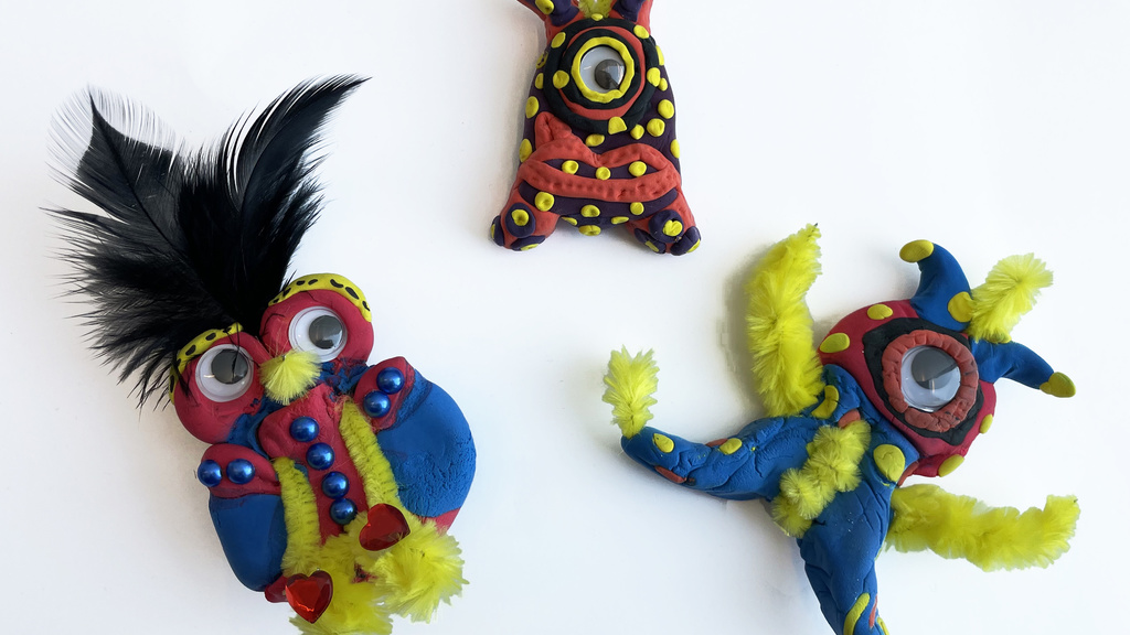 Colorful clay figurines with googly eyes and ebellishments