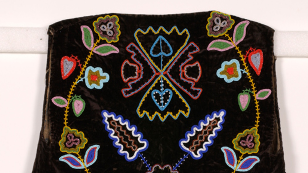 colorfully beaded black velvet vest with vine/floral and arrow head patterns