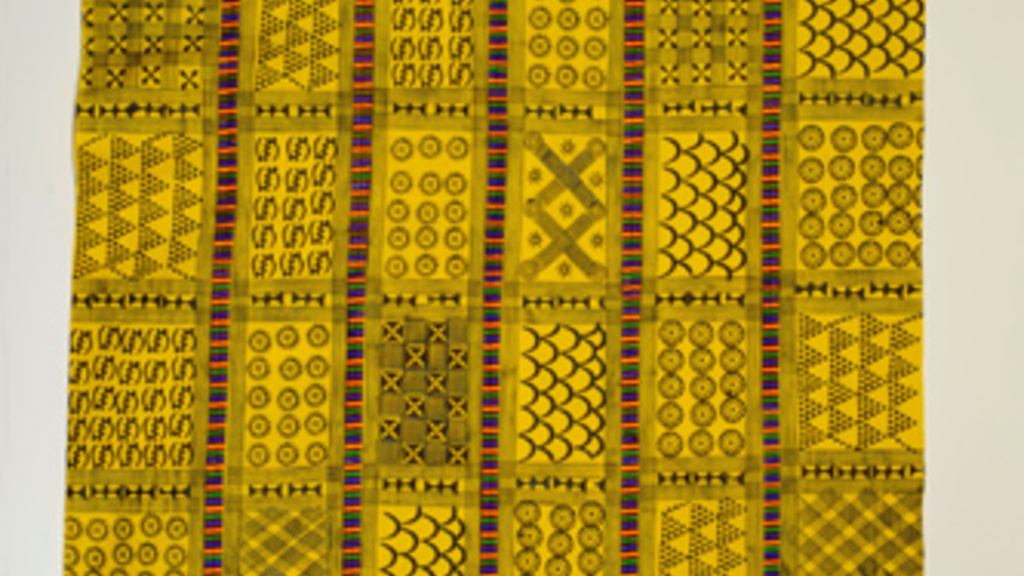 Large piece of bright yellow cotton cloth which features columns containing a variety of repeating symbols in black called adinkra that each hold their own distinct historic and philosophical meanings for the Asante people.