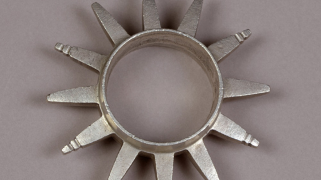Round metal bracelet encircled with spikes resembling abstract animal horns.